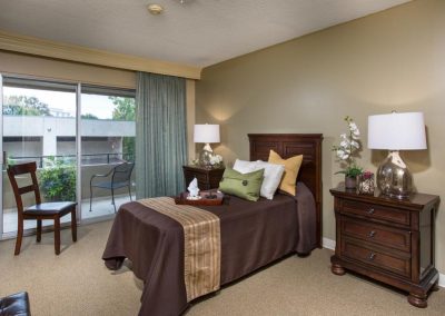 Resident room decorated in rich warm brown colors.